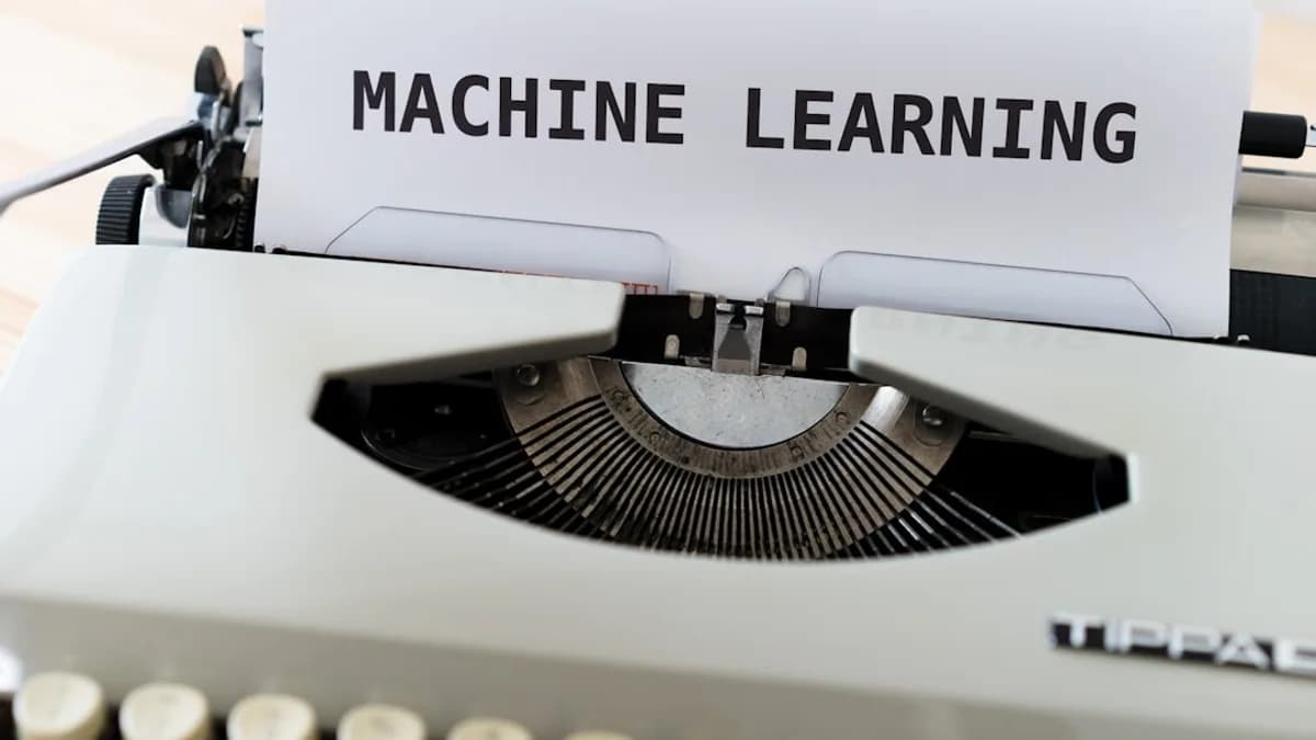 a close up of a typewriter with a paper reading machine learning