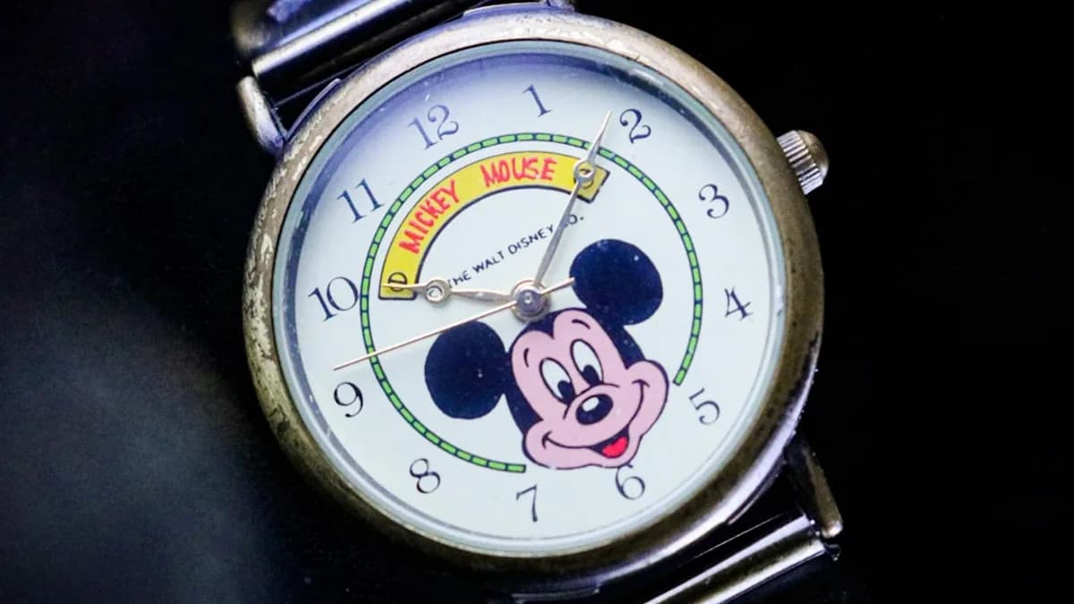 green and white analog watch