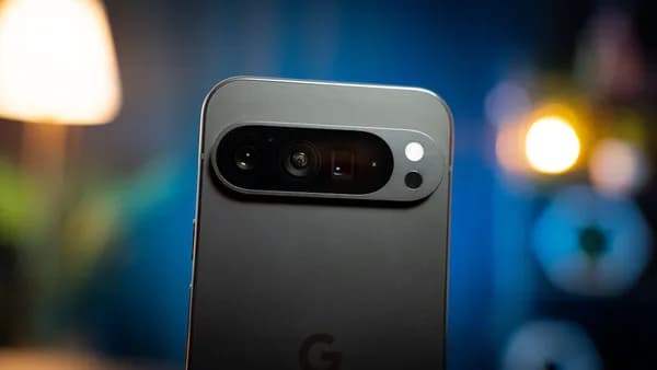 A close up of a cell phone with a blurry background