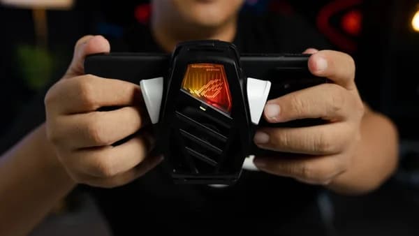 A man holding a cell phone in his hands