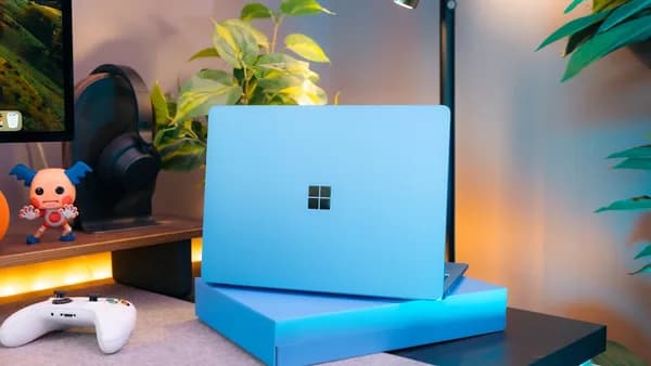 A laptop computer sitting on top of a desk