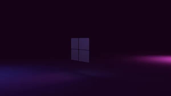 a dark room with a purple light coming out of the window