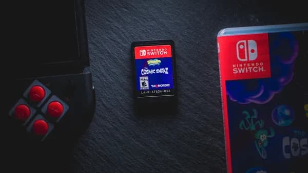 a nintendo switch sitting next to a game controller