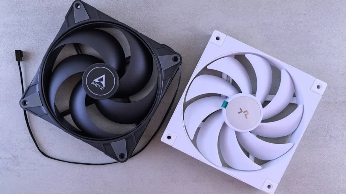 Two computer fans, one black and one white.