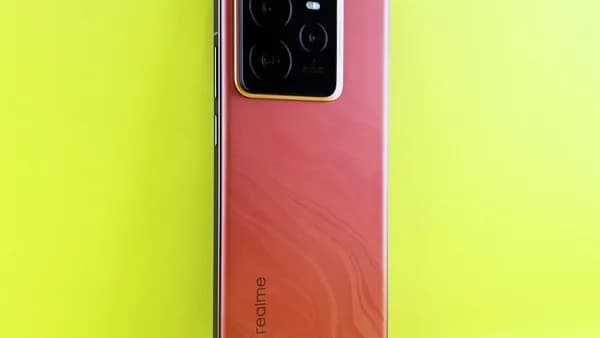 Red smartphone with camera array on yellow background