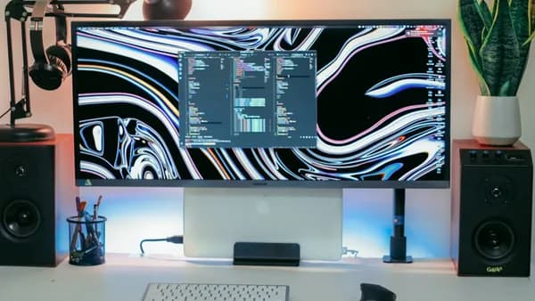 a computer monitor sitting on top of a desk