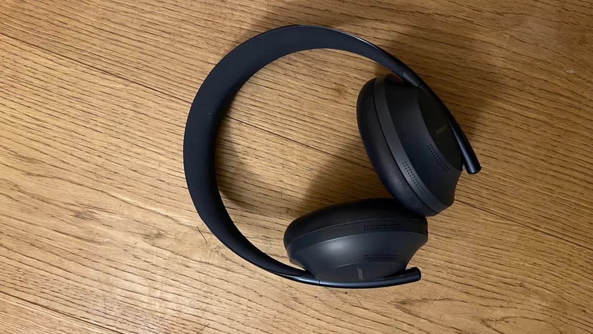 a pair of headphones sitting on top of a wooden table