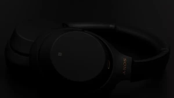 black and gray headphones on white surface