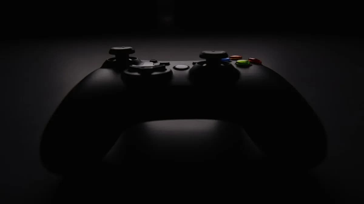 shallow focus photography of black Xbox controller