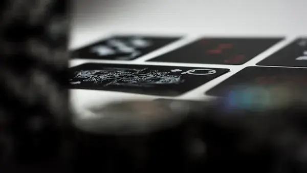 a stack of playing cards sitting on top of a table