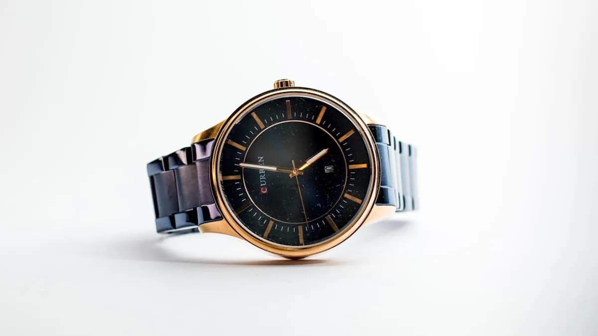 silver and gold round analog watch