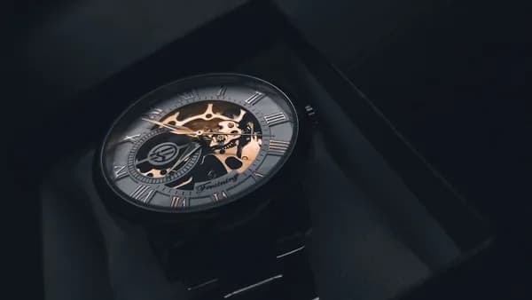 a watch sitting on top of a black box