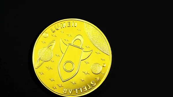 gold round coin with black background