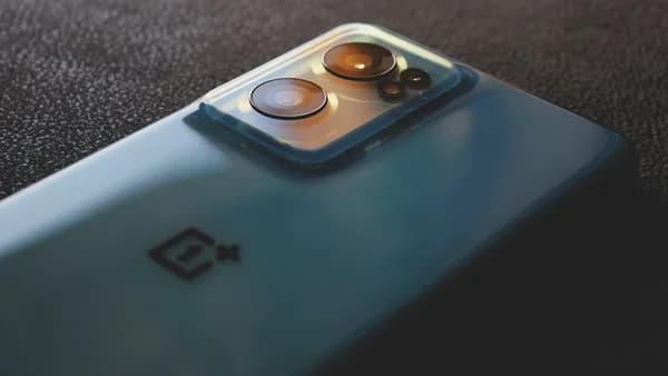 a close up of a cell phone with two buttons