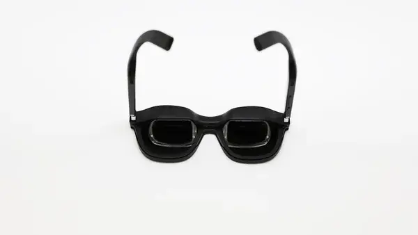 Black 3D glasses on a white background