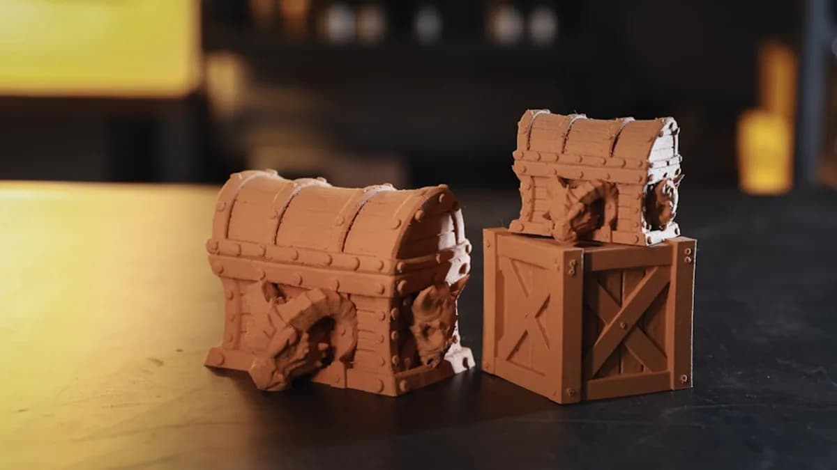 A close up of two pieces of clay on a table