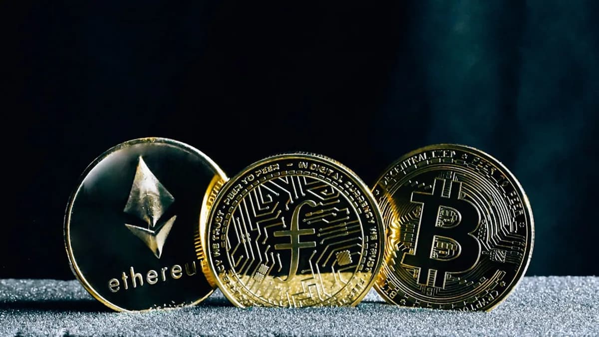 three bitcoins sitting on top of a table