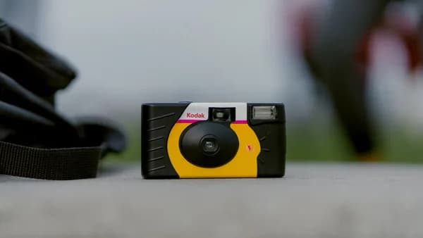 selective focus photograph of black and yellow Kodak camera