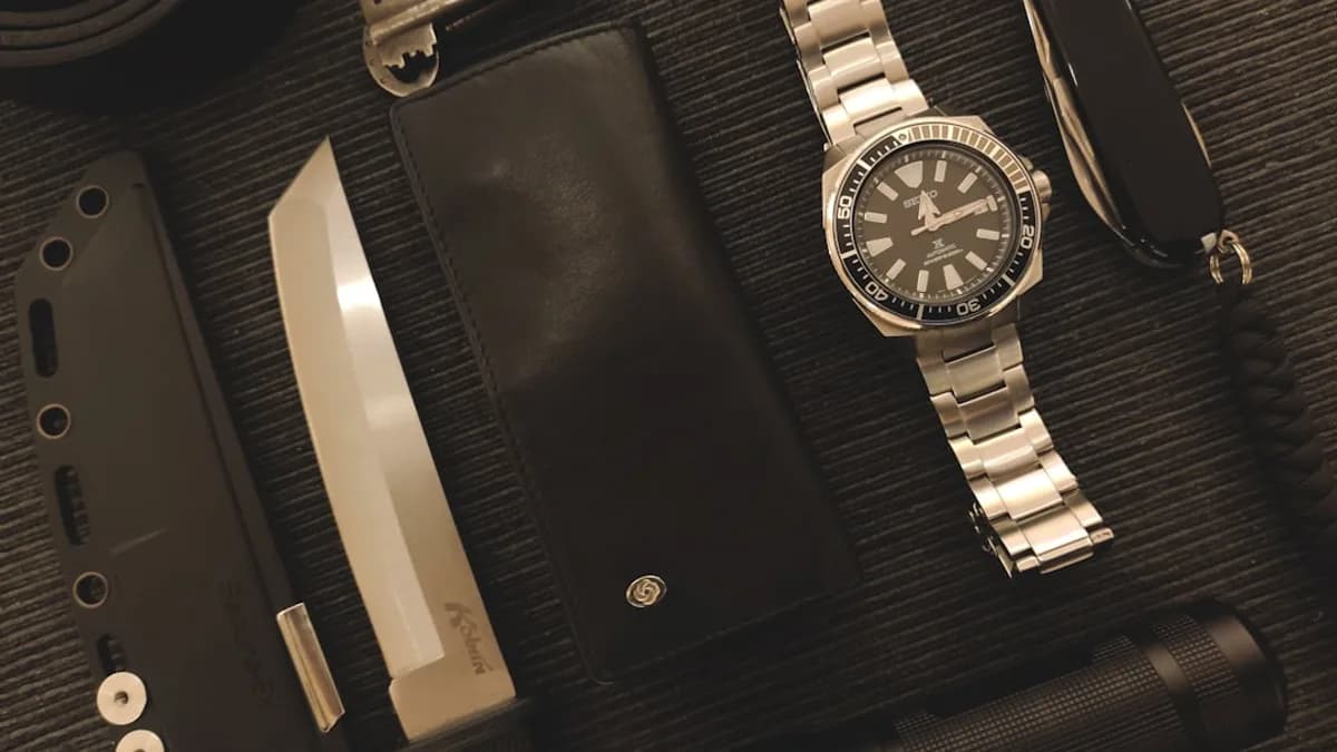 Everyday carry items on a textured surface.