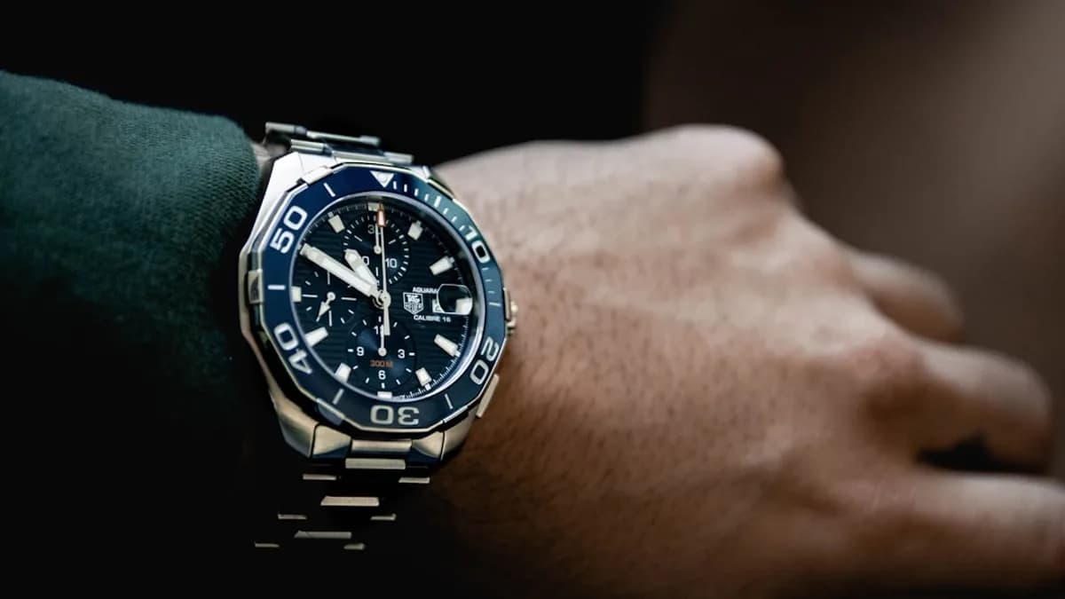 round black chronograph watch at 5:50