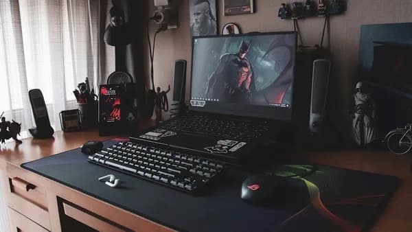 a laptop sits on top of a desk