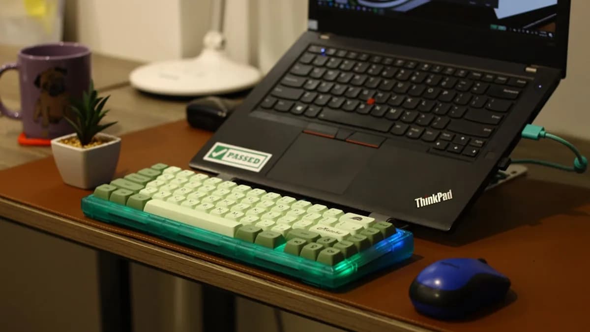 A laptop with a mechanical keyboard and mouse.