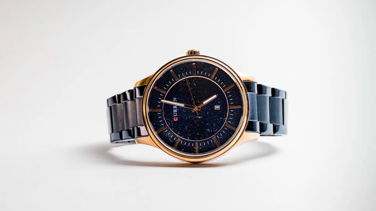 silver and gold round analog watch